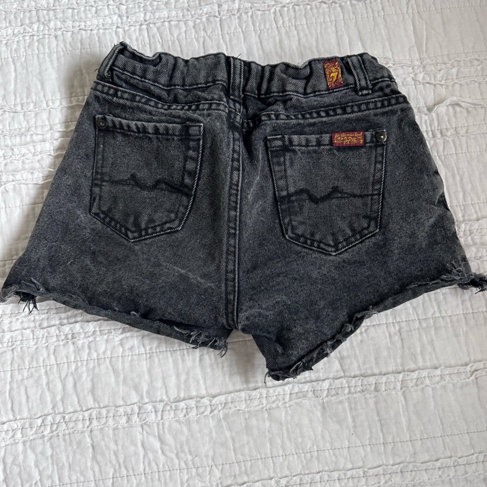 Girls seven for all mankind black distressed shorts.